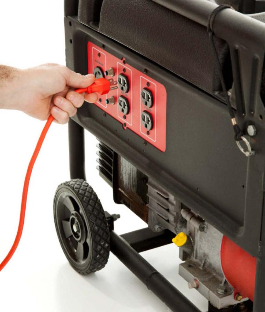 hand plugging cord into generator